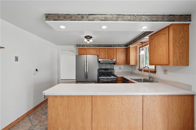 413 Stilley Rd, Jefferson Hills, PA 15025 - kitchen with appliances with stainless steel finishes, under cabinet range hood, a sink, a peninsula, and light countertops