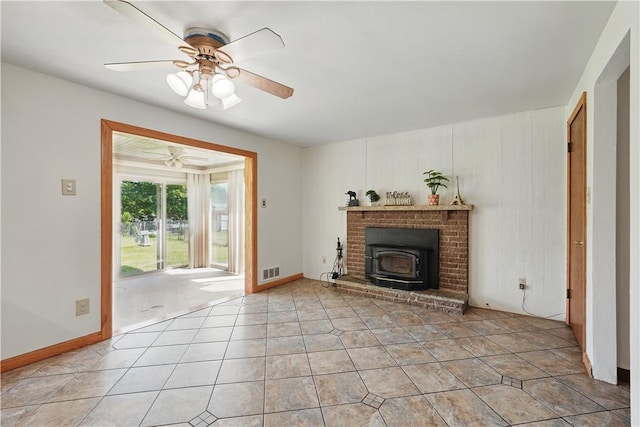 413 Stilley Rd, Jefferson Hills, PA 15025 - living area featuring ceiling fan, light tile patterned floors, and a wood stove