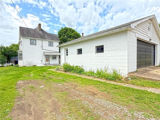 419 Washington Ave, Leechburg Boro, PA 15656 - rear view of property with a lawn and a garage