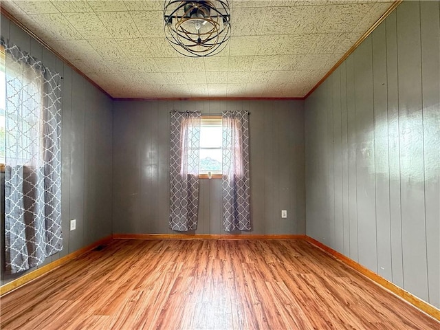 419 Washington Ave, Leechburg Boro, PA 15656 - empty room with wood finished floors, baseboards, and an ornate ceiling