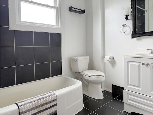 419 Washington Ave, Leechburg Boro, PA 15656 - bathroom with a bathtub, vanity, toilet, tile patterned flooring, and baseboards