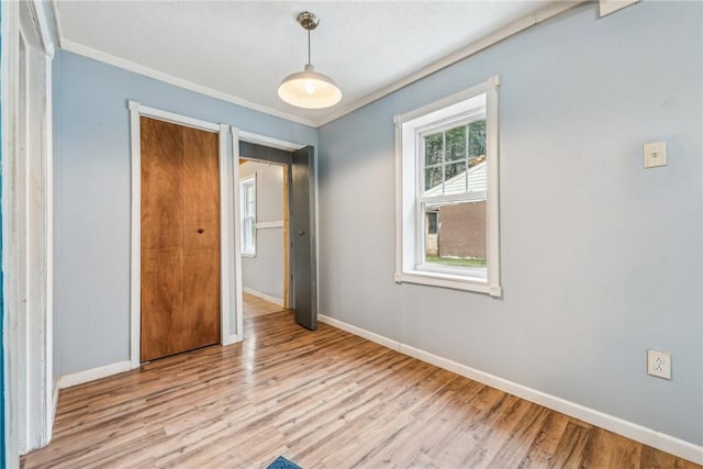 316 Dutchman Run Rd, Lower Burrell, PA 15068 - unfurnished bedroom featuring baseboards, wood finished floors, and crown molding
