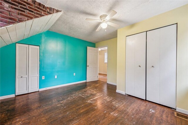 316 Dutchman Run Rd, Lower Burrell, PA 15068 - unfurnished bedroom with wood-type flooring, baseboards, a ceiling fan, vaulted ceiling, and a textured ceiling