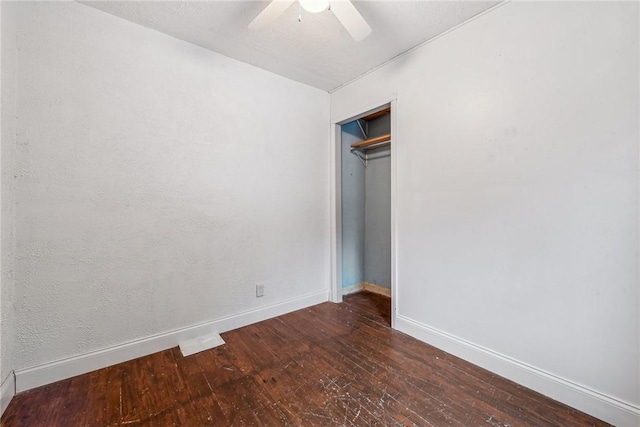 316 Dutchman Run Rd, Lower Burrell, PA 15068 - unfurnished bedroom featuring hardwood / wood-style floors, baseboards, a closet, and ceiling fan