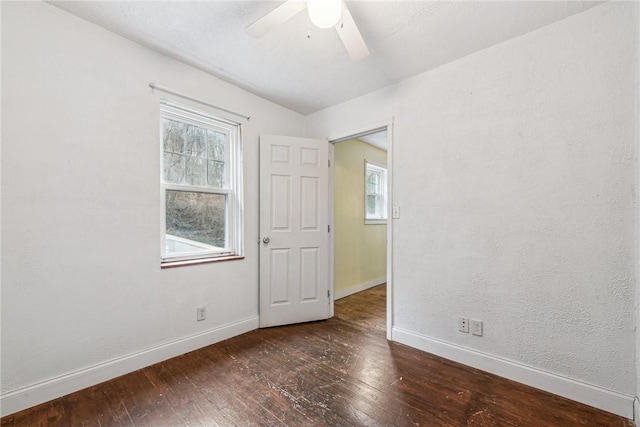 316 Dutchman Run Rd, Lower Burrell, PA 15068 - unfurnished room with baseboards, wood-type flooring, ceiling fan, and plenty of natural light
