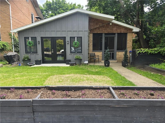 2819 Glenmore, Dormont, PA 15216 - rear view of property featuring board and batten siding, brick siding, and french doors
