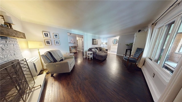 2819 Glenmore, Dormont, PA 15216 - living room featuring wood finished floors, radiator heating unit, a stone fireplace, and baseboards