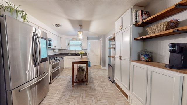 2819 Glenmore, Dormont, PA 15216 - kitchen featuring stainless steel appliances, decorative backsplash, white cabinetry, open shelves, and a sink