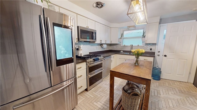 2819 Glenmore, Dormont, PA 15216 - kitchen with appliances with stainless steel finishes, dark countertops, tasteful backsplash, and a sink