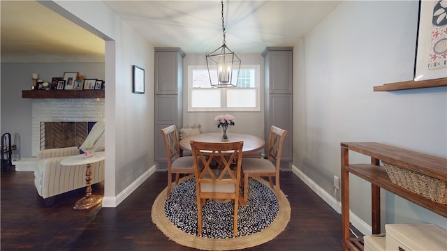 2819 Glenmore, Dormont, PA 15216 - dining area with baseboards, wood finished floors, and a fireplace