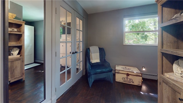 2819 Glenmore, Dormont, PA 15216 - sitting room with french doors, wood finished floors, and a baseboard radiator