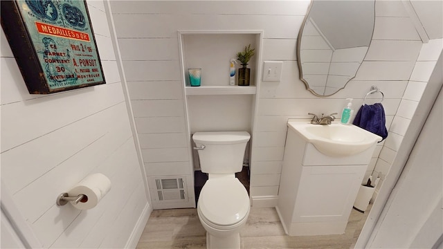 2819 Glenmore, Dormont, PA 15216 - half bathroom featuring toilet, vanity, and wood finished floors