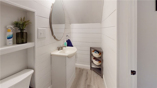 2819 Glenmore, Dormont, PA 15216 - half bathroom featuring toilet, vanity, and wood finished floors
