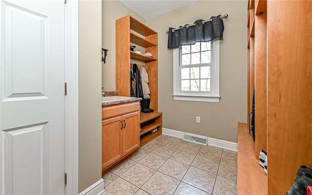 3124 Canterbury Dr, Hampton, PA 15101 - mudroom featuring baseboards, light tile patterned floors, and a sink