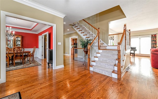 3124 Canterbury Dr, Hampton, PA 15101 - entryway featuring crown molding, stairway, wood finished floors, and baseboards
