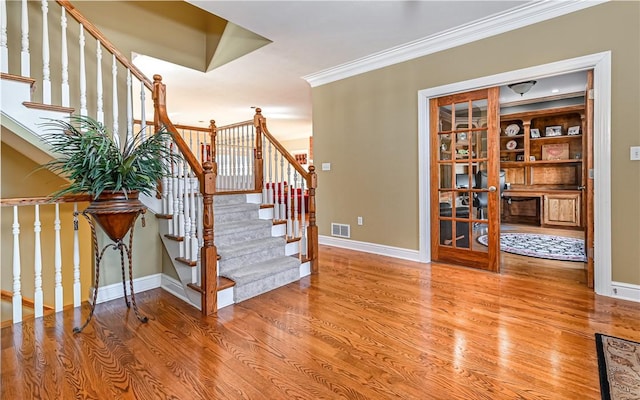 3124 Canterbury Dr, Hampton, PA 15101 - stairway featuring baseboards, wood finished floors, and crown molding