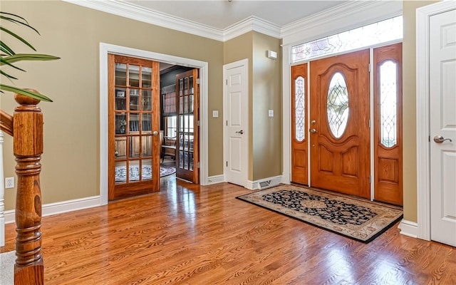 3124 Canterbury Dr, Hampton, PA 15101 - entryway featuring french doors, baseboards, wood finished floors, and ornamental molding