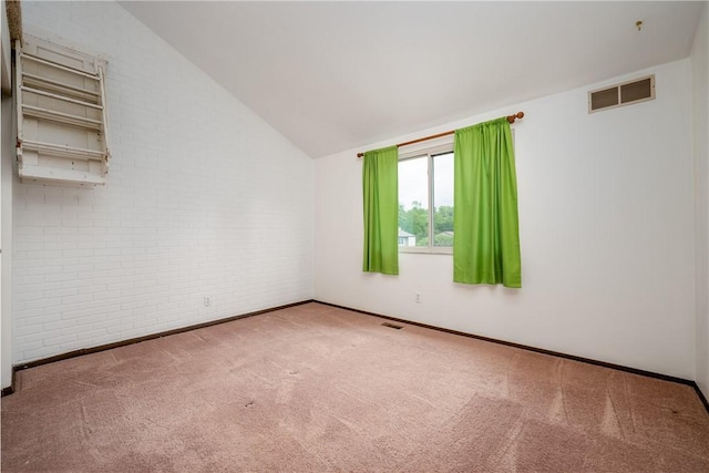 3131 Cheltenham Ct, Hampton, PA 15044 - spare room featuring brick wall, carpet floors, baseboards, and lofted ceiling