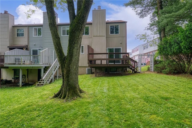 3131 Cheltenham Ct, Hampton, PA 15044 - back of property featuring stairway, a wooden deck, and a lawn