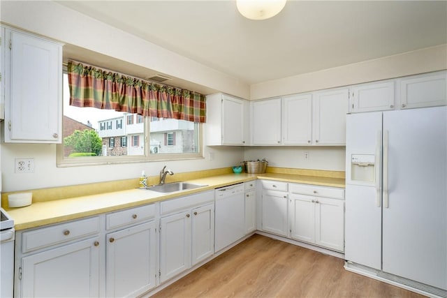 3131 Cheltenham Ct, Hampton, PA 15044 - kitchen with white appliances, a sink, white cabinets, light wood-type flooring, and light countertops