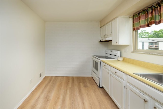 3131 Cheltenham Ct, Hampton, PA 15044 - kitchen with white range with electric cooktop, under cabinet range hood, light wood-style flooring, and white cabinetry