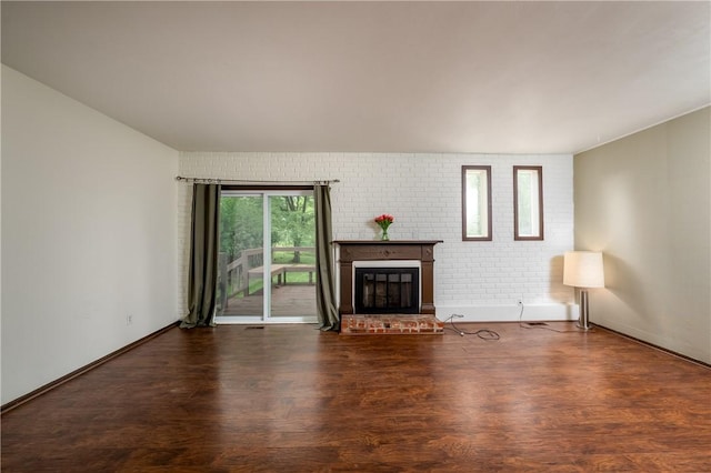 3131 Cheltenham Ct, Hampton, PA 15044 - unfurnished living room with a fireplace, wood finished floors, brick wall, and baseboards