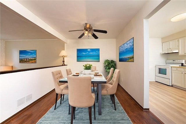 3131 Cheltenham Ct, Hampton, PA 15044 - dining room with wood finished floors, a ceiling fan, and baseboards