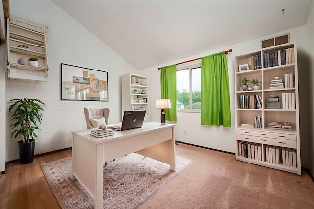 3131 Cheltenham Ct, Hampton, PA 15044 - home office featuring brick wall, vaulted ceiling, wood finished floors, and baseboards
