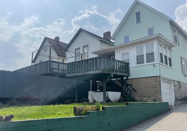 622 E 10th Ave, Tarentum, PA 15084 - back of house with a wooden deck, a garage, and stairs