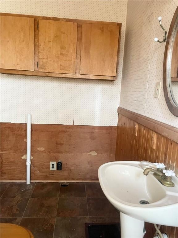 622 E 10th Ave, Tarentum, PA 15084 - half bathroom featuring wallpapered walls, a wainscoted wall, and a sink