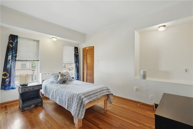 216 11th St, Sharpsburg, PA 15215 - bedroom with wood finished floors, baseboards, and a closet