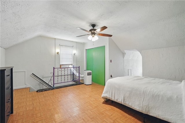 216 11th St, Sharpsburg, PA 15215 - bedroom featuring a textured ceiling, lofted ceiling, and a ceiling fan