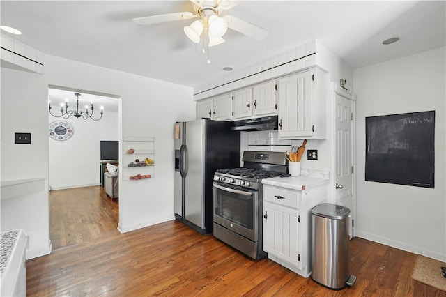 216 11th St, Sharpsburg, PA 15215 - kitchen featuring appliances with stainless steel finishes, under cabinet range hood, ceiling fan, light countertops, and dark wood-style flooring