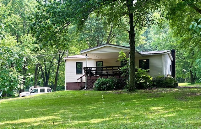 358 Mahood Rd, Center Twp But, PA 16001 - view of side of property featuring a yard, metal roof, and a deck