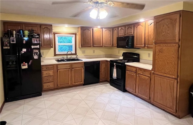 358 Mahood Rd, Center Twp But, PA 16001 - kitchen with black appliances, a sink, light countertops, ceiling fan, and light floors