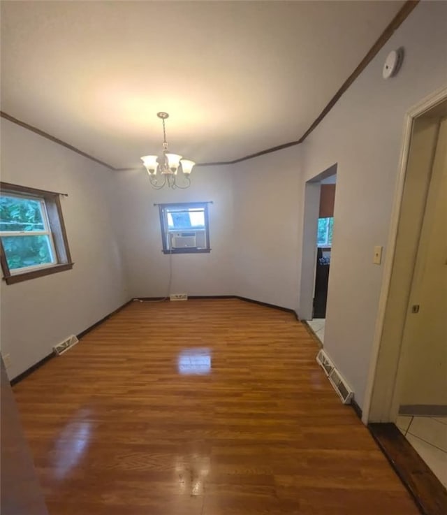 115 N Ray St, New Castle/3Rd, PA 16101 - unfurnished room featuring healthy amount of natural light, a chandelier, light wood-type flooring, ornamental molding, and a smoke detector