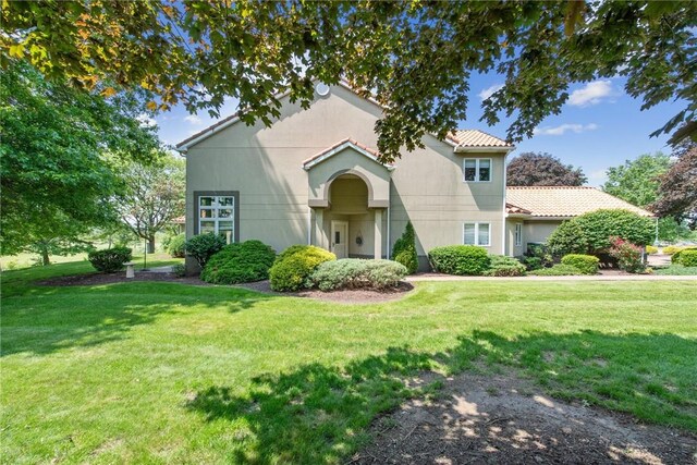 3532 Fairway Ct, Blairsville Area, PA 15717 - view of front of home with a front lawn, a tiled roof, and stucco siding