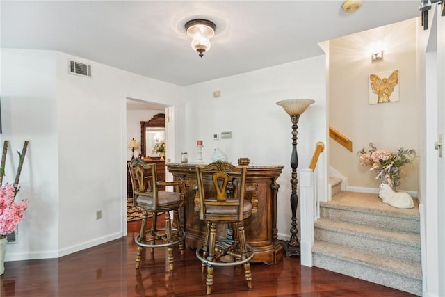 3532 Fairway Ct, Blairsville Area, PA 15717 - dining room with a dry bar, stairs, wood finished floors, and baseboards