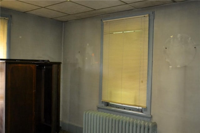 117 Grant Ave, Shaler, PA 15223 - detailed view of radiator heating unit, a paneled ceiling, and baseboards