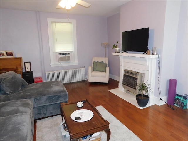 508 Bosses Row, Crucible, PA 15325 - living area featuring radiator, ceiling fan, cooling unit, wood finished floors, and heating unit