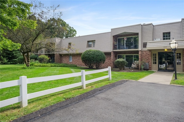 595 Calais Dr Unit 324, Mccandless, PA 15237 - view of front of home featuring brick siding, mansard roof, and central AC
