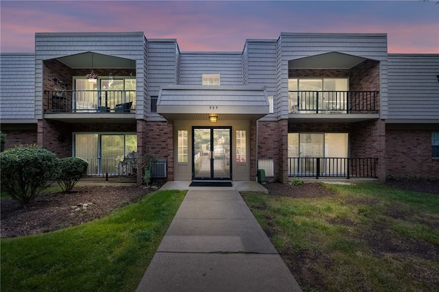 595 Calais Dr Unit 324, Mccandless, PA 15237 - view of exterior entry with french doors, brick siding, and a balcony