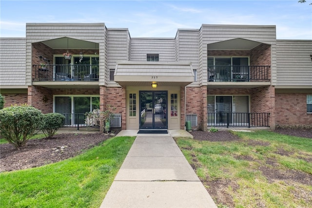 595 Calais Dr Unit 324, Mccandless, PA 15237 - view of front of home featuring brick siding and a balcony