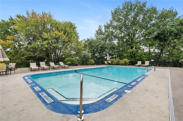 595 Calais Dr Unit 324, Mccandless, PA 15237 - community pool with view of wooded area and a patio area