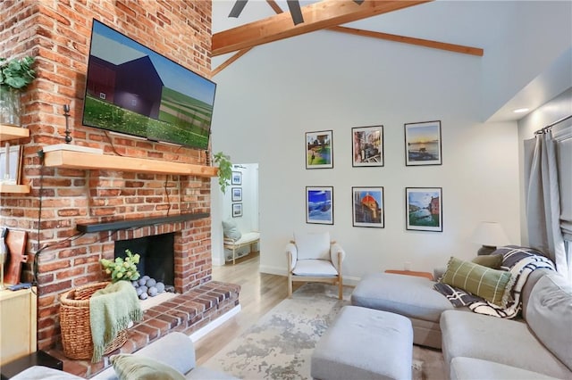 2971 Acre Rd, Scott Twp Law, PA 16101 - living area with wood finished floors, a brick fireplace, beamed ceiling, ceiling fan, and baseboards