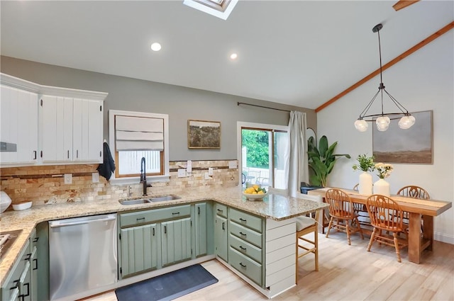 2971 Acre Rd, Scott Twp Law, PA 16101 - kitchen with stainless steel dishwasher, a sink, lofted ceiling, tasteful backsplash, and a peninsula