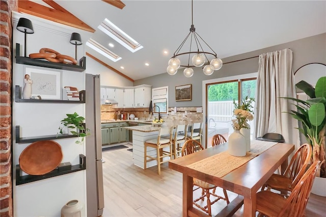 2971 Acre Rd, Scott Twp Law, PA 16101 - dining room featuring vaulted ceiling, a skylight, recessed lighting, light wood finished floors, and a chandelier