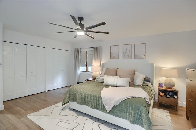 2971 Acre Rd, Scott Twp Law, PA 16101 - bedroom with two closets, light wood-type flooring, a ceiling fan, and baseboards