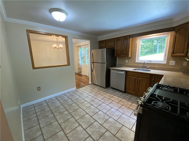 728 Heathergate, Indiana Twp Nal, PA 15238 - kitchen featuring appliances with stainless steel finishes, a sink, a chandelier, plenty of natural light, and ornamental molding