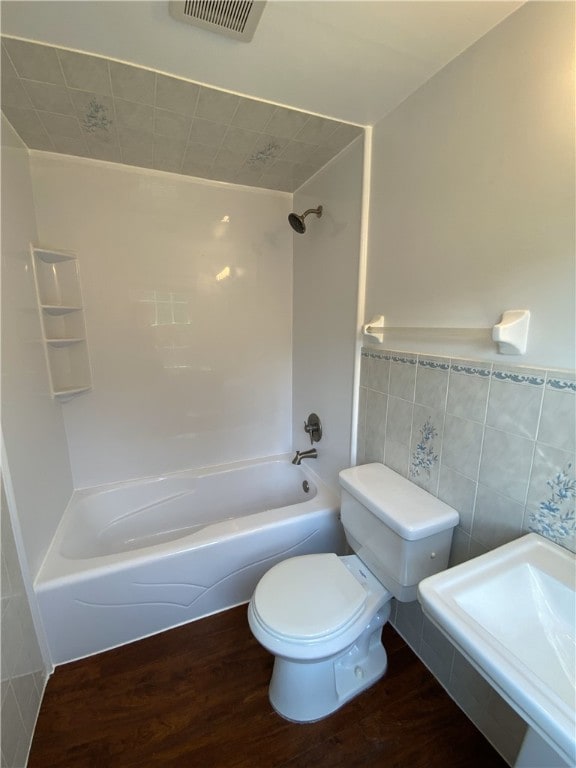 728 Heathergate, Indiana Twp Nal, PA 15238 - bathroom featuring wood finished floors, toilet, shower / washtub combination, and tile walls